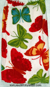 Large, colorful butterflies on hand towel