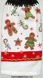 gingerbread boy and girl cookies on hanging kitchen hand towel