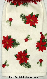 poinsettias and berries on hand towel