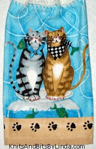 two cats on hanging kitchen hand towel