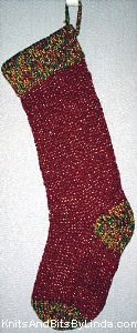 Burgundy knitted Christmas stocking with Multi 1 gold burgundy green cuff with gold shiny thread
