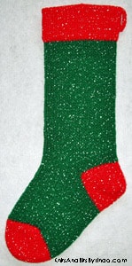 Traditional Green 1 knitted sparkle Christmas stocking with red cuff, heel and toe with silver thread