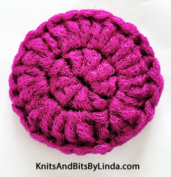 round fuschia 3 inch scrubbie