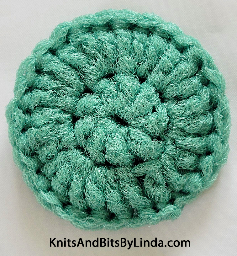 sage green round scrubbie 3 inche wide